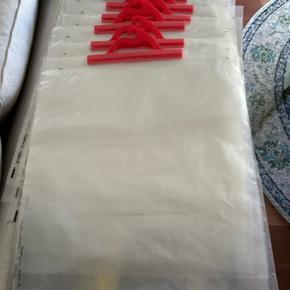 Clear Plastic Garment Bags with Red Hangers - Set